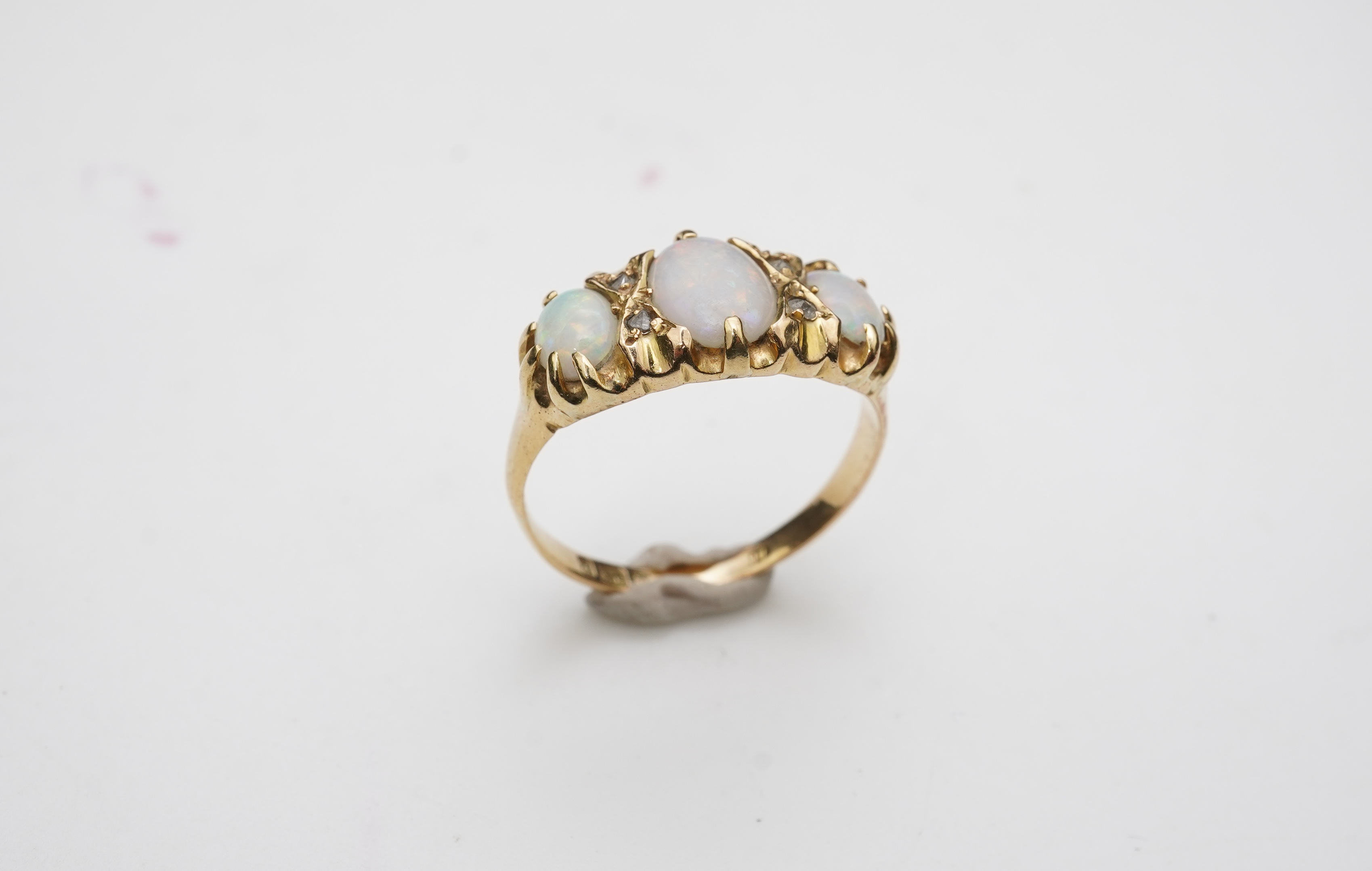 A Victorian 18ct gold and opal ring, circa 1898